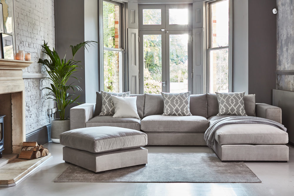Grey modular sofa with loose footstool 